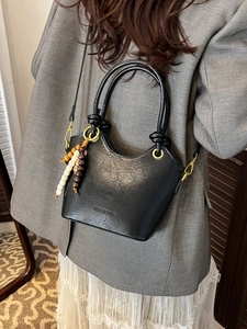 Retro black leather bucket bag for women with wooden bead tassel and double ring handles