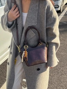 Vintage dark brown soft leather bucket bag for women with luxury bead charm detail