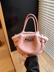 Pink faux suede tote bag with fur trim and silver turn-lock closure for winter