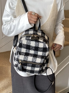 Mini plaid backpack for women with black and white woolen fabric and gold hardware