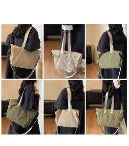 Detail view of khaki and olive green tote bags showing multiple carrying styles on a model