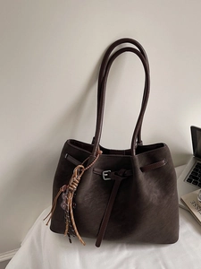 Retro dark brown matte tote bag with ethnic tassel charm and large capacity for daily use