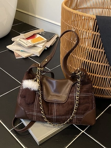 Plaid patchwork shoulder bag in brown faux leather with fuzzy ball charm and chain