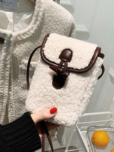 Chic sherpa fleece crossbody bag with leather trim and vintage horn buckle closure