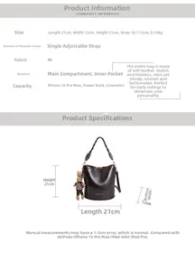 Detail view of brown vintage bucket bag with woven handle and cute rabbit charm