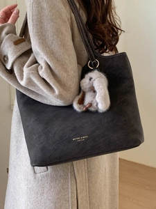 Dark gray large capacity leather tote bag for women with plush rabbit charm and shoulder strap