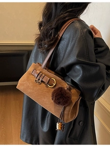 Retro dark brown faux suede shoulder bag with plush charm and buckle detail