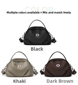 Three shell-shaped commuter bags in black, khaki, and dark brown with shoulder straps