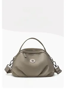 Front view of taupe PU leather handbag featuring metal zipper and adjustable strap