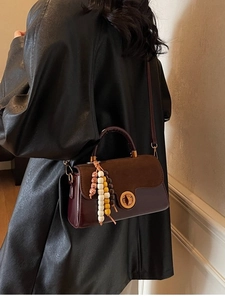 Retro burgundy and brown leather handbag with metal lock and colorful wood bead charm