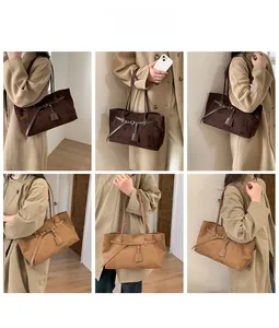 Detail shots of vintage frosted tote bags in dark coffee and khaki on a fashion model