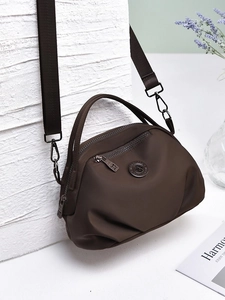 Dark brown nylon dumpling shoulder bag with adjustable wide strap and top handle