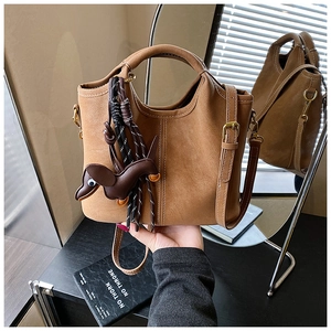 Brown frosted tote bag featuring a cute dog charm and dual-strap design in mirror reflection