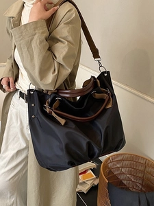 Retro canvas tote bag in black nylon with brown straps and large capacity for daily commuting