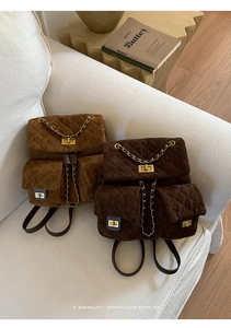 Detail of quilted suede backpacks in brown and dark coffee with golden twist lock