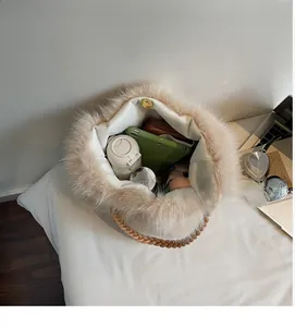 Top view of large capacity plush tote bag interior with beige fur and brown woven handles