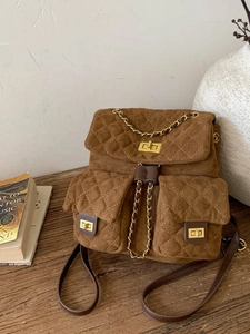 Brown faux suede quilted backpack with gold chain straps and retro diamond pattern