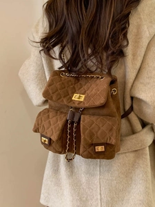 Vintage brown quilted suede backpack with gold chain straps and twist-lock detail