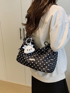 Black and white polka dot shoulder bag with cute white cloud plush pendant accessory