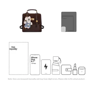 Detail view of the large capacity dark brown leather backpack with various travel essentials