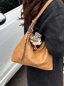 Brown vintage hobo bag in faux leather with cute bear charm and knotted wide shoulder strap