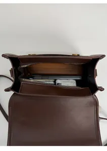Detailed top view of the vintage brown leather backpack interior showing large capacity
