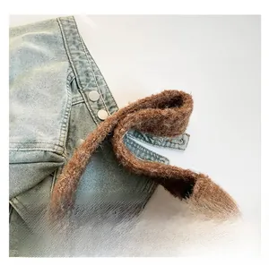 Detail of comfortable plush tote handle with soft faux fur texture and brown finish