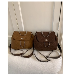 Detailed comparison of quilted chain bags in khaki and dark brown with metal locks