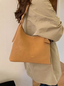 Caramel matte leather hobo bag by Panton London with wide shoulder strap and gold logo