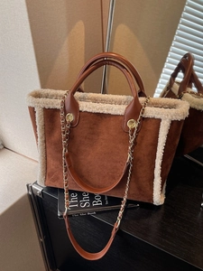 Winter dark brown suede tote bag with white faux fur trim and elegant chain strap