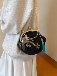 Embroidered black silk shell bag with gold chain strap and floral bird patterns