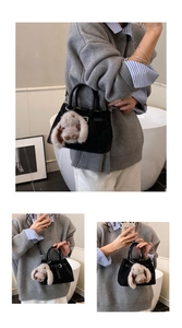 Detailed view of a black bucket bag with a cute beige plush bunny charm on the side
