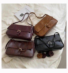Collection of vintage leather underarm bags in burgundy, caramel, brown, and black colors
