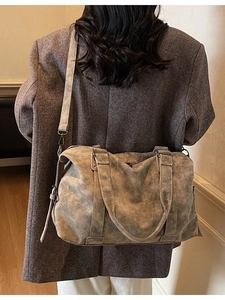 Retro grey textured tote bag with top handles and shoulder strap shown from back view