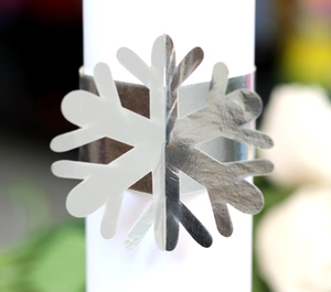 Macro view of silver snowflake napkin ring with mirror finish for wedding decor