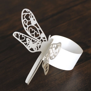 Laser-cut dragonfly paper napkin ring in white with heart hollow out patterns