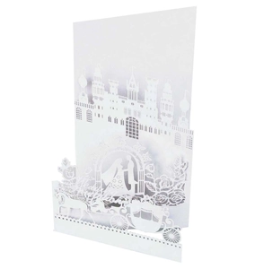 Detailed laser-cut 3D wedding card with a white carriage, castle, and couple silhouettes