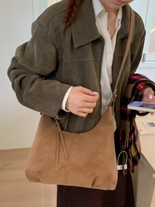 Brown suede hobo shoulder bag with a vintage slouchy dumpling shape for daily wear