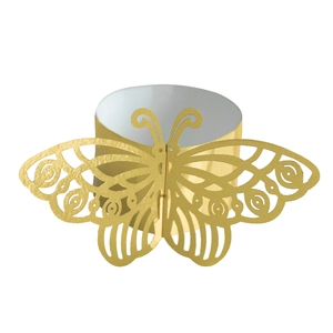Macro view of gold laser-cut hollow butterfly napkin ring with intricate geometric pattern