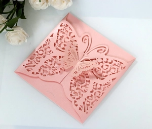 Detailed laser-cut butterfly wedding invitation cover in elegant pearl pink paper