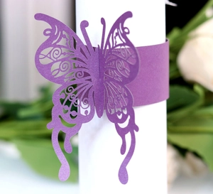 Elegant purple laser-cut butterfly napkin ring with intricate floral hollow patterns