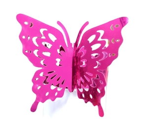 Detail of rose pink hollow butterfly napkin ring with laser-cut lace pattern for decor