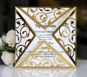 Elegant gold laser-cut invitation with European vine patterns and white insert card