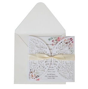 Laser cut butterfly wedding invitation set with floral inner card and cream ribbon