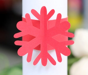 Macro shot of a red hollowed snowflake napkin ring for Christmas table decorations