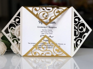 Elegant laser-cut floral invitation with white pearl inner card on reflective surface