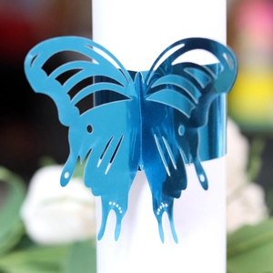 Elegant bright blue metallic butterfly napkin ring with hollow laser-cut wing patterns