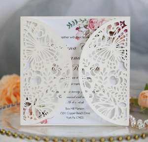 Detailed laser-cut butterfly wedding invitation with ivory floral inner card