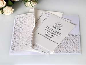 Detailed laser-cut wedding invitation set with elegant floral pocket and RSVP cards