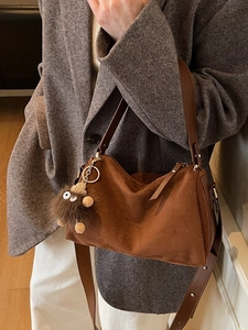 Brown frosted leather shoulder bag with plush pendant, stylish minimalist commute handbag